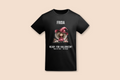 A black Girl in the Red Dress Halloween Tee is displayed flat, featuring a personalized name and Halloween graphic.