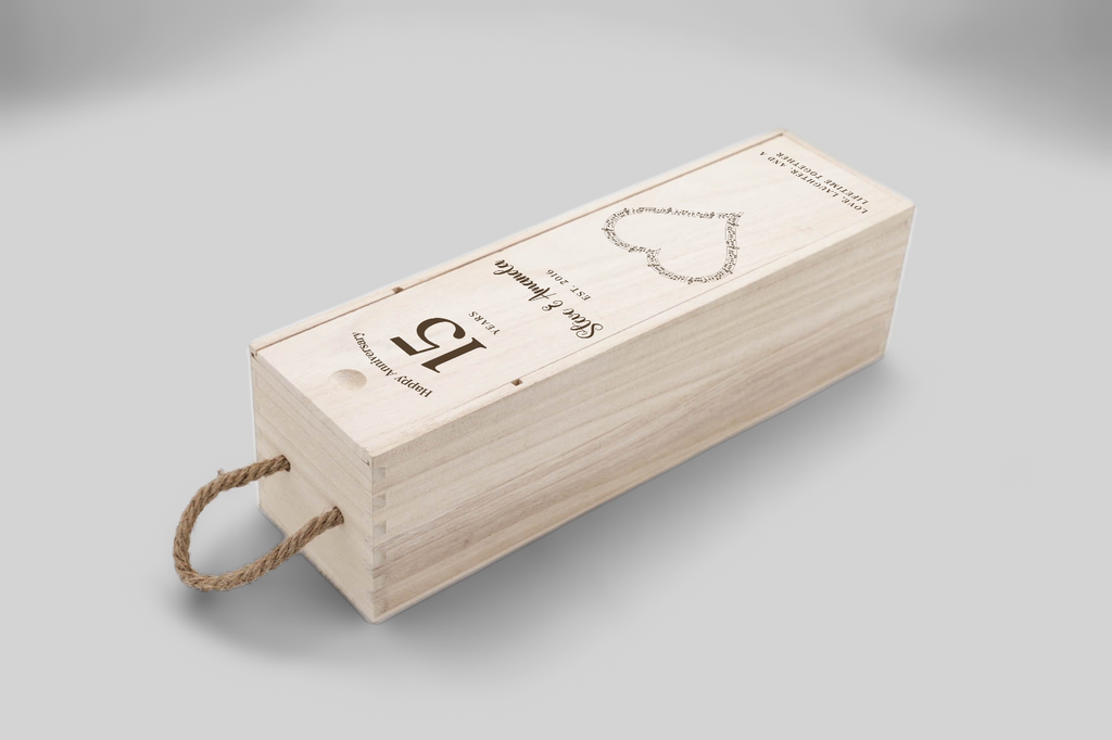 This musical heart anniversary wine box is presented from an elevated front view, highlighting the engraved heart design and.