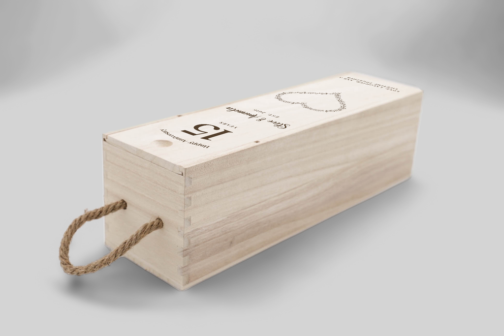 The musical heart anniversary wine box is shown at a three-quarter right angle, featuring a rope handle and personalised.