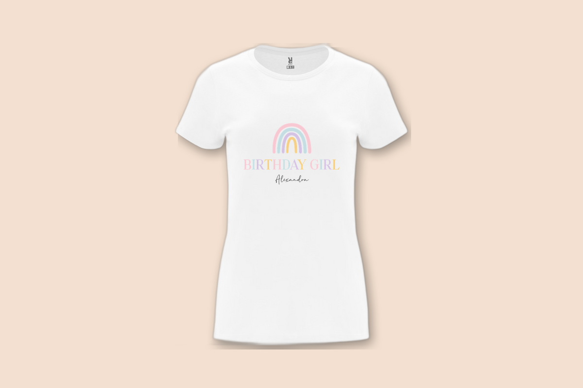A white Pastel Rainbow Birthday Tee is displayed flat, showing the pastel rainbow graphic and "Birthday Girl Alexandra" text.