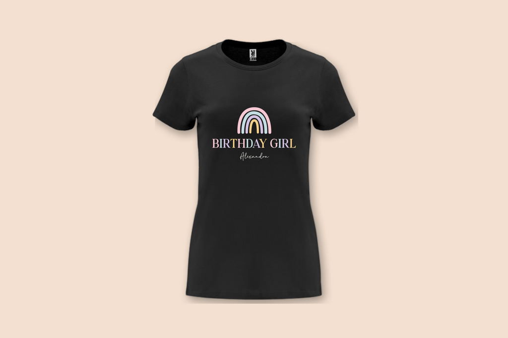 This black Pastel Rainbow Birthday Tee features a minimalist pastel rainbow design with "Birthday Girl Alexandra" text.