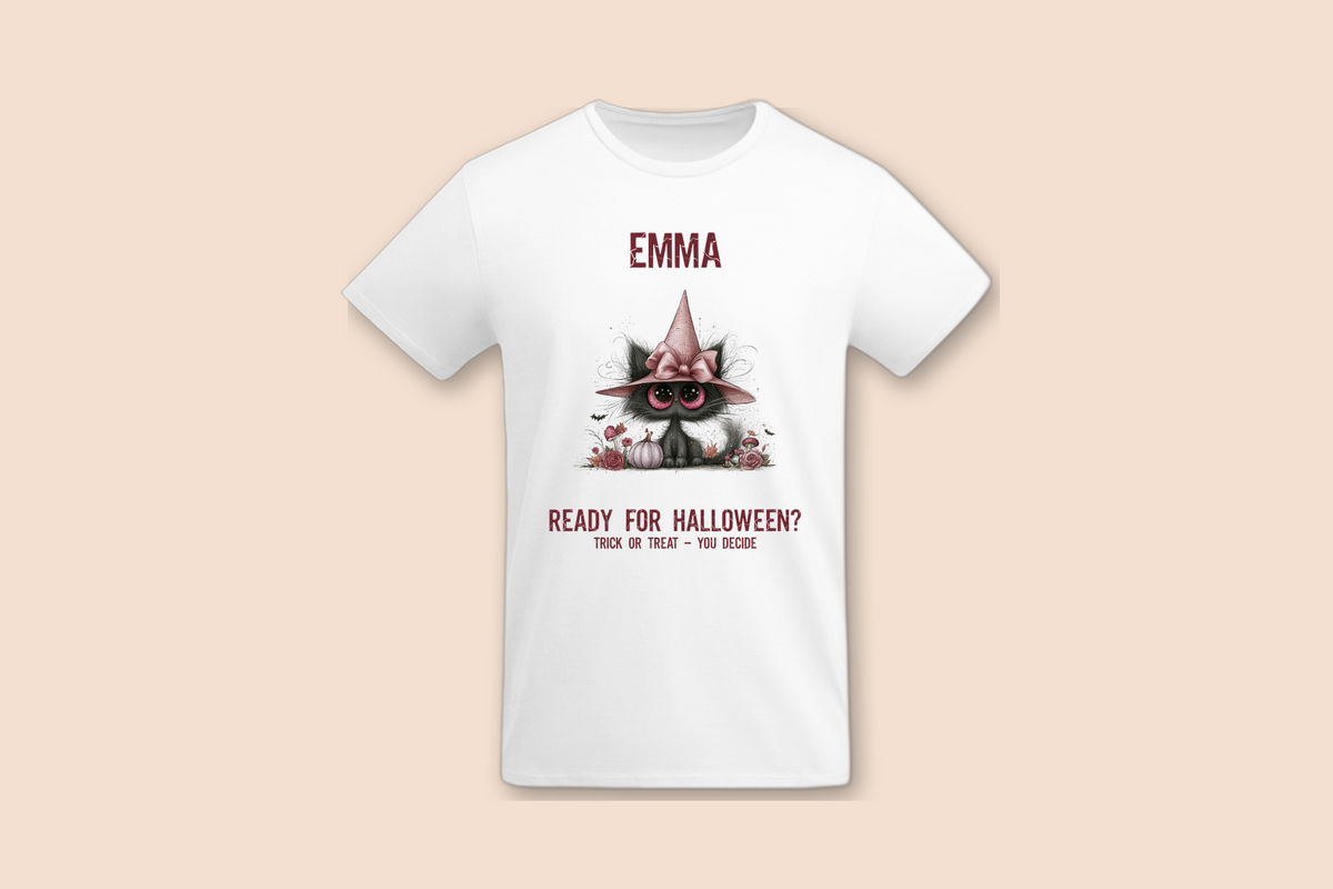 A white Pink Pumpkin Cat - Halloween Tee is shown flat, with a black cat design wearing a pink witch hat.