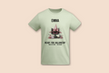 A light green Pink Pumpkin Cat - Halloween Tee is displayed flat, featuring a black cat wearing a pink witch hat.