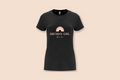 A black "The Pinks" Birthday Girl Rainbow Tee with a personalized name displayed on a plain background.